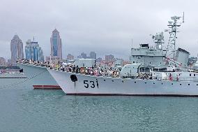 Tourists Visit A Decommissioned Warship in Qingdao