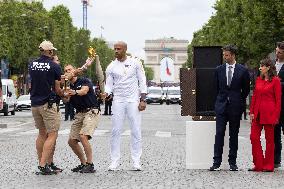 Olympic Torch Relay Along the Champs-Elysees Avenue - Paris