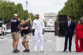 Olympic Torch Relay Along the Champs-Elysees Avenue - Paris