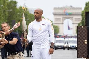 Olympic Torch Relay Along the Champs-Elysees Avenue - Paris