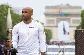 Olympic Torch Relay Along the Champs-Elysees Avenue - Paris