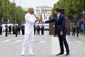 Olympic Torch Relay Along the Champs-Elysees Avenue - Paris