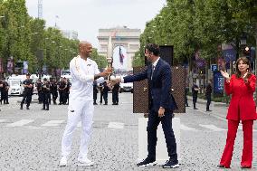 Olympic Torch Relay Along the Champs-Elysees Avenue - Paris