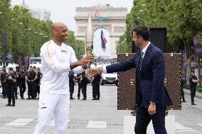 Olympic Torch Relay Along the Champs-Elysees Avenue - Paris