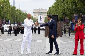 Olympic Torch Relay Along the Champs-Elysees Avenue - Paris