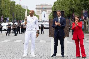 Olympic Torch Relay Along the Champs-Elysees Avenue - Paris