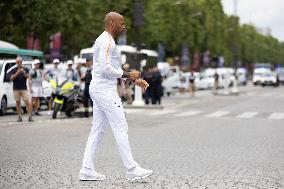 Olympic Torch Relay Along the Champs-Elysees Avenue - Paris