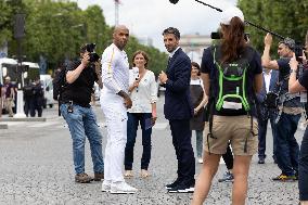 Olympic Torch Relay Along the Champs-Elysees Avenue - Paris