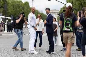 Olympic Torch Relay Along the Champs-Elysees Avenue - Paris