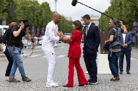 Olympic Torch Relay Along the Champs-Elysees Avenue - Paris