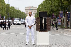 Olympic Torch Relay Along the Champs-Elysees Avenue - Paris