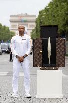 Olympic Torch Relay Along the Champs-Elysees Avenue - Paris