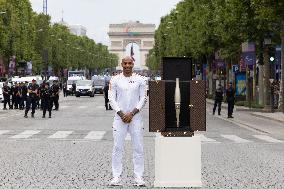 Olympic Torch Relay Along the Champs-Elysees Avenue - Paris