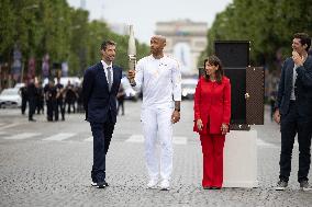 Olympic Torch Relay Along the Champs-Elysees Avenue - Paris