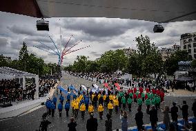 Olympic flame during the annual Bastille Day military parade - Paris