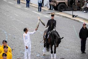 Olympic flame during the annual Bastille Day military parade - Paris