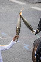 Olympic flame during the annual Bastille Day military parade - Paris