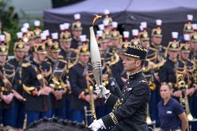 Olympic flame during the annual Bastille Day military parade - Paris