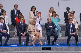 Olympic flame during the annual Bastille Day military parade - Paris