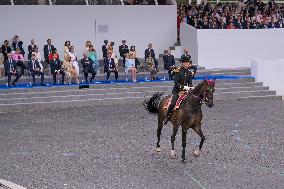 Olympic flame during the annual Bastille Day military parade - Paris