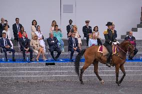 Olympic flame during the annual Bastille Day military parade - Paris