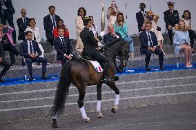 Olympic flame during the annual Bastille Day military parade - Paris