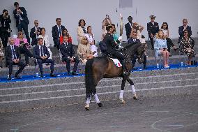 Olympic flame during the annual Bastille Day military parade - Paris