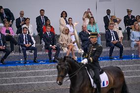 Olympic flame during the annual Bastille Day military parade - Paris