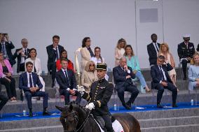 Olympic flame during the annual Bastille Day military parade - Paris