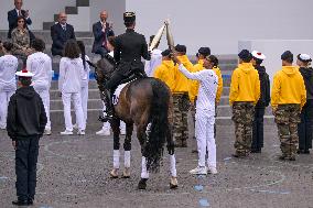 Olympic flame during the annual Bastille Day military parade - Paris