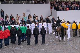 Olympic flame during the annual Bastille Day military parade - Paris