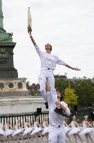 Olympic Torch flame Relay on the Bastille Place - Paris