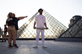 Olympic Torch Relay at the Louvre Pyramid- Paris