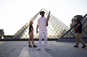 Olympic Torch Relay at the Louvre Pyramid- Paris