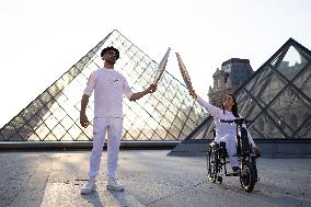 Olympic Torch Relay at the Louvre Pyramid- Paris