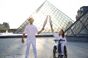 Olympic Torch Relay at the Louvre Pyramid- Paris