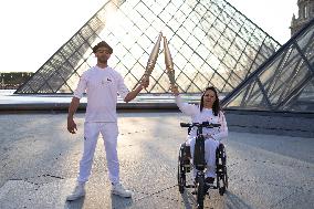 Olympic Torch Relay at the Louvre Pyramid- Paris