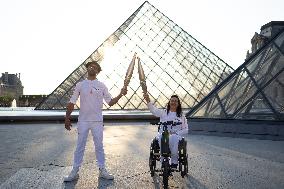 Olympic Torch Relay at the Louvre Pyramid- Paris