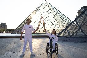 Olympic Torch Relay at the Louvre Pyramid- Paris