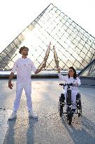 Olympic Torch Relay at the Louvre Pyramid- Paris