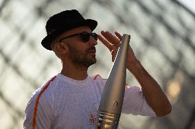 Olympic Torch Relay at the Louvre Pyramid- Paris