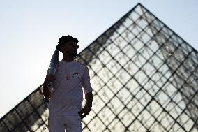 Olympic Torch Relay at the Louvre Pyramid- Paris