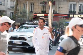 Paris 2024 - Jamel Debbouze Carries The Olympic Torch