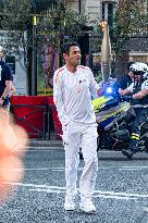 Paris 2024 - Jamel Debbouze Carries The Olympic Torch