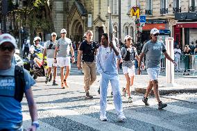 Paris 2024 - Jamel Debbouze Carries The Olympic Torch