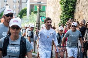 Paris 2024 - Arnaud Clement Carries The Olympic Torch