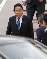 Japan PM Kishida returns home