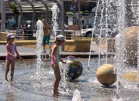 Bathing in Vinnytsia fountain on hot summer day