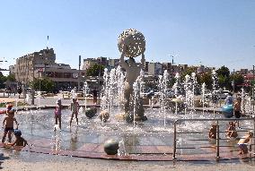 Bathing in Vinnytsia fountain on hot summer day