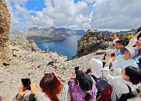 Tourists Visit The Tianchi Lake of Changbai Mountain in Yanbian